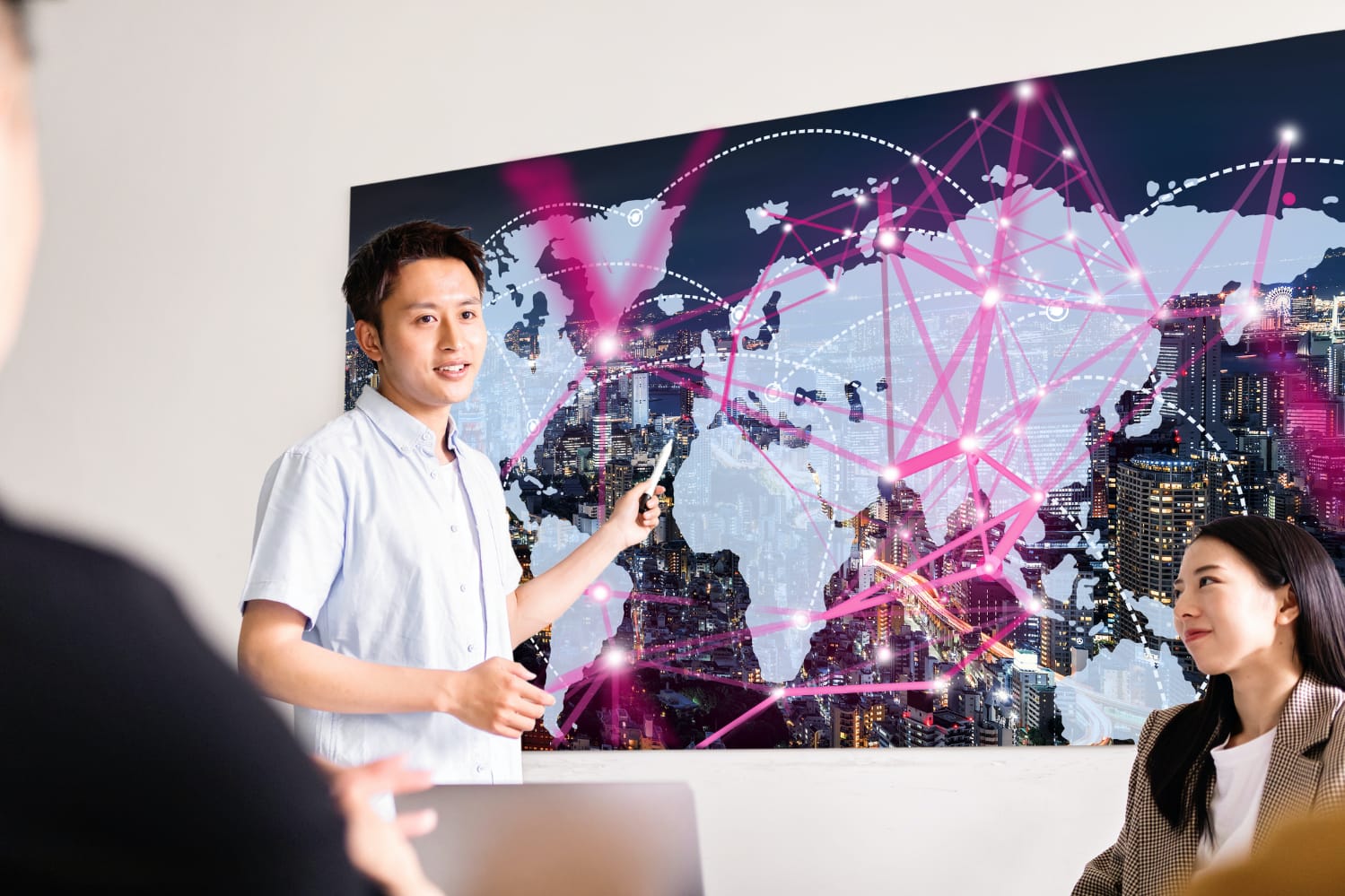 asian man in front of world map