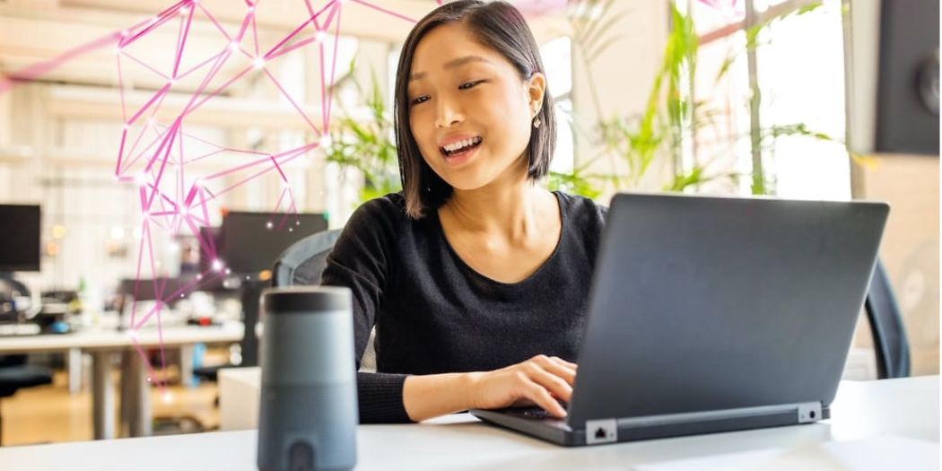 asian women in front of laptop looking at speaker