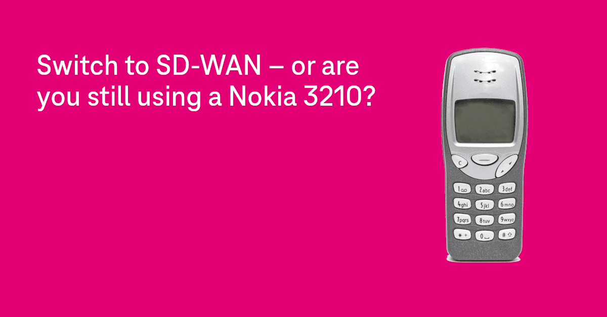 Magenta colored background with a Nokia 3210 on top.